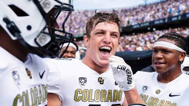 Trevor Woods smiling after 45-42 win at TCU